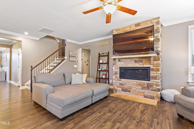 living room with visible vents, crown molding, baseboards, stairway, and wood finished floors