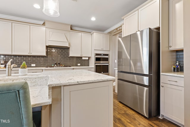 kitchen with stainless steel appliances, dark wood finished floors, decorative backsplash, and ornamental molding