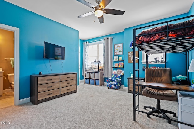 bedroom with connected bathroom, baseboards, a ceiling fan, and carpet flooring