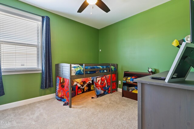 bedroom featuring baseboards, carpet floors, and ceiling fan