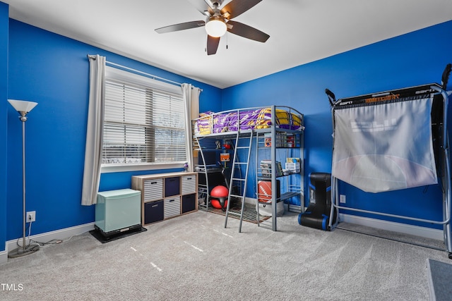 unfurnished bedroom featuring baseboards, ceiling fan, and carpet flooring