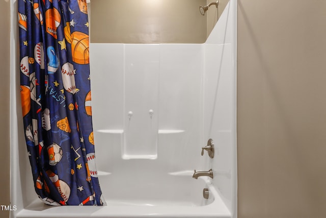 bathroom with shower / bath combo