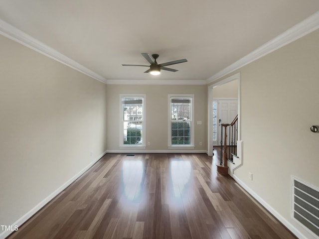 unfurnished living room featuring visible vents, crown molding, baseboards, stairs, and dark wood-style flooring