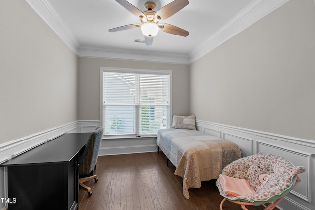 bedroom featuring visible vents, wainscoting, crown molding, and dark wood-style flooring