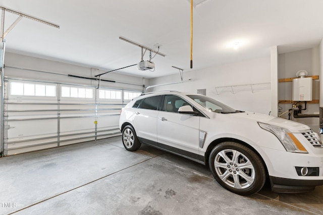 garage featuring a garage door opener and water heater