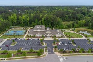 birds eye view of property with a wooded view