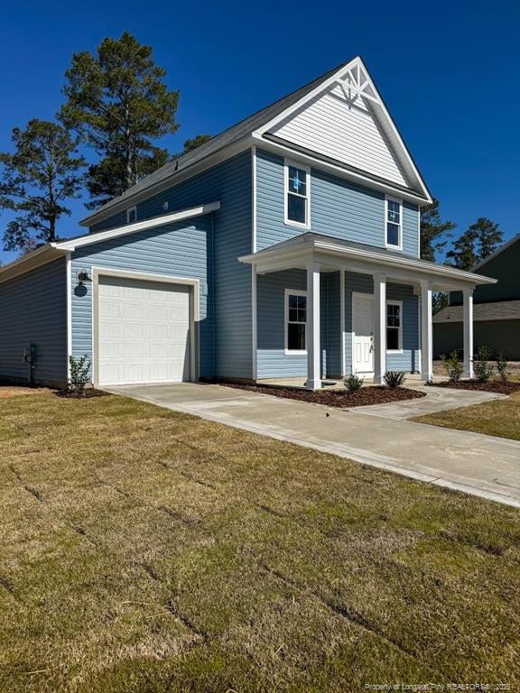 view of front of house featuring a front lawn, an attached garage, covered porch, and concrete driveway