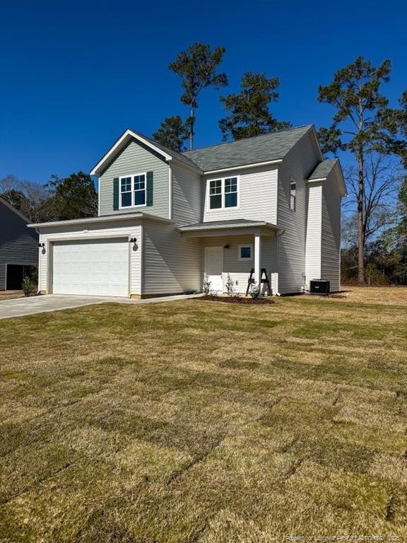 traditional-style house featuring a garage, central AC unit, concrete driveway, and a front yard