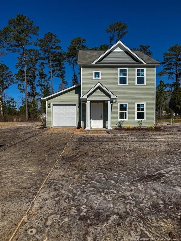 view of front of home with a garage and driveway