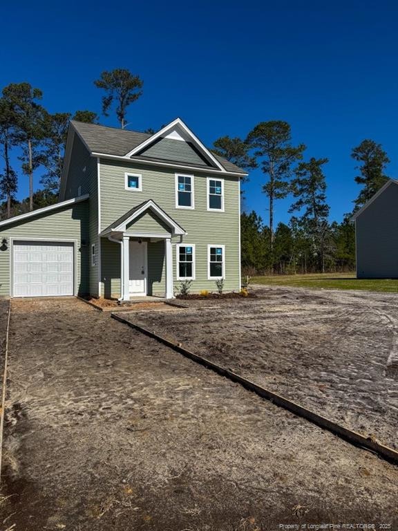 view of front of home with a garage and driveway