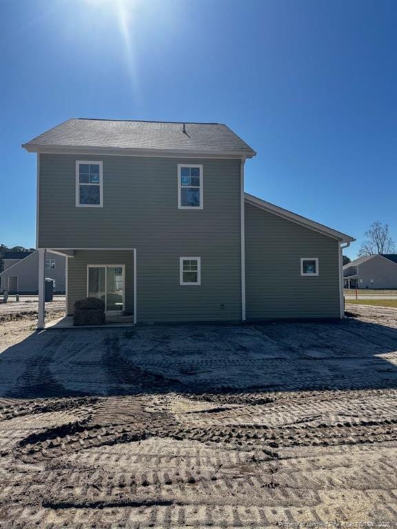 back of house with a patio area