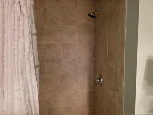 room details with a tile shower