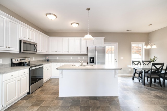 kitchen featuring a sink, stainless steel appliances, white cabinetry, and light countertops