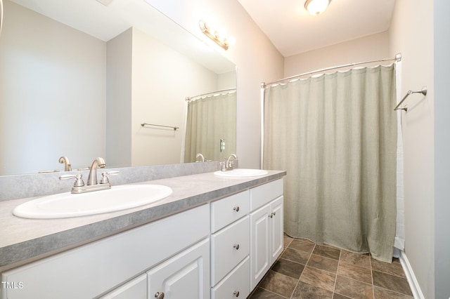 bathroom with double vanity and a sink