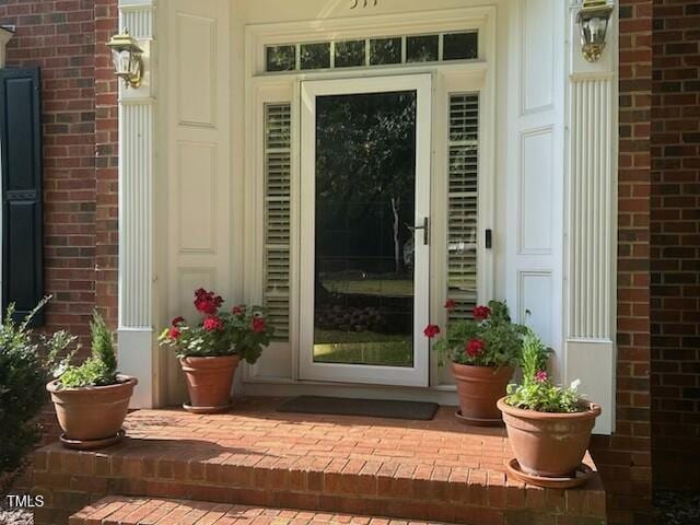 511 Windstream Way, Cary, NC 27518 - doorway to property featuring brick siding