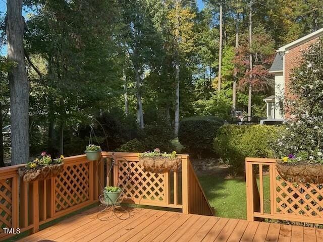 511 Windstream Way, Cary, NC 27518 - wooden terrace with view of scattered trees