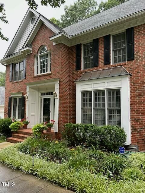 511 Windstream Way, Cary, NC 27518 - colonial house featuring brick siding