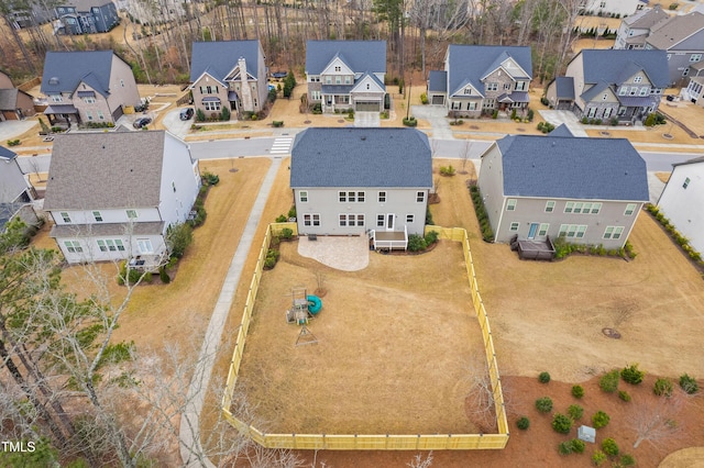 birds eye view of property with a residential view