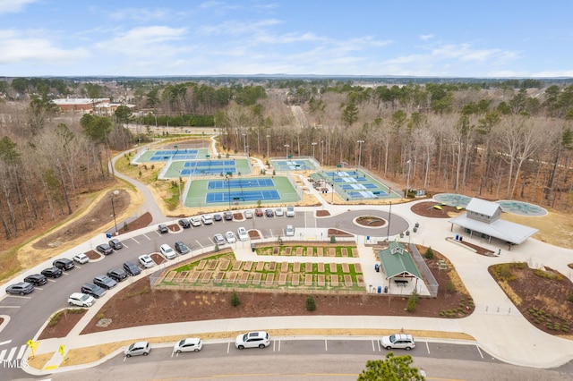 aerial view featuring a wooded view