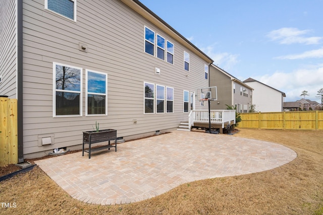 back of property with crawl space, a residential view, fence, and a patio area