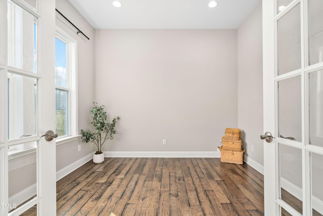 unfurnished room featuring wood finished floors, recessed lighting, french doors, and baseboards