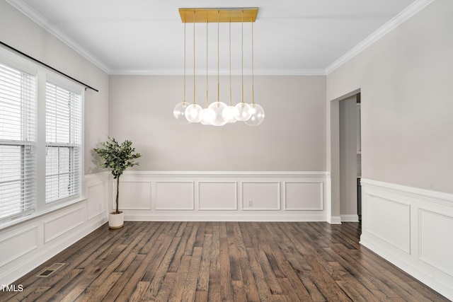 unfurnished dining area with crown molding, dark wood-style floors, visible vents, and wainscoting