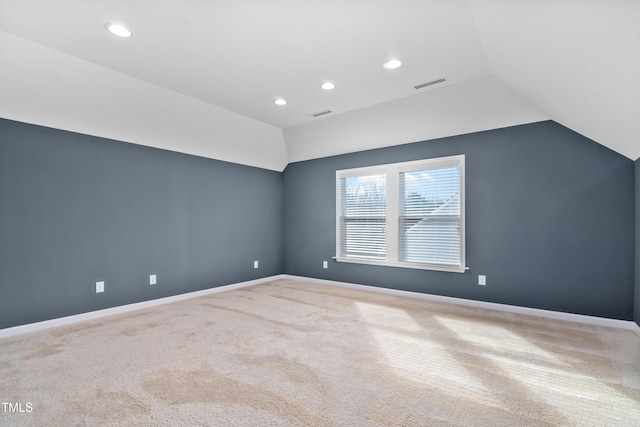 additional living space with baseboards, visible vents, carpet floors, lofted ceiling, and recessed lighting