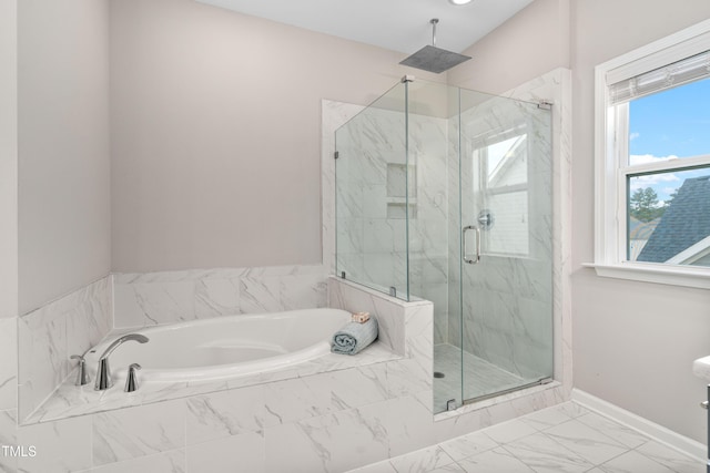 bathroom with a garden tub, baseboards, marble finish floor, and a marble finish shower