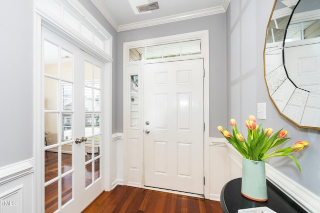 entryway with dark wood-style floors, visible vents, french doors, and ornamental molding