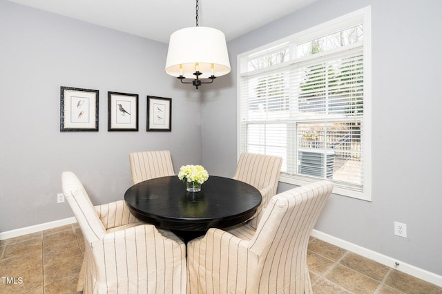 dining space featuring baseboards