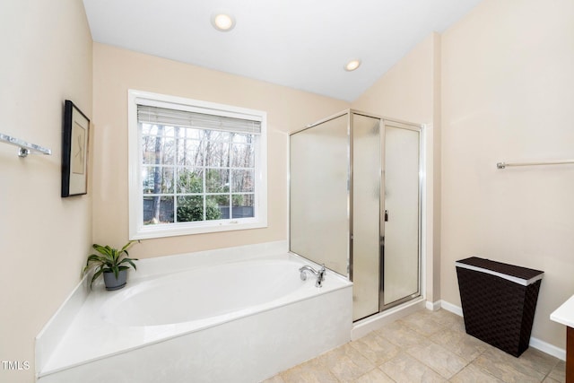 full bath featuring a stall shower, baseboards, a bath, and recessed lighting