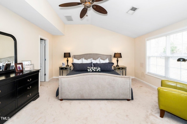 carpeted bedroom with visible vents, ceiling fan, baseboards, and lofted ceiling