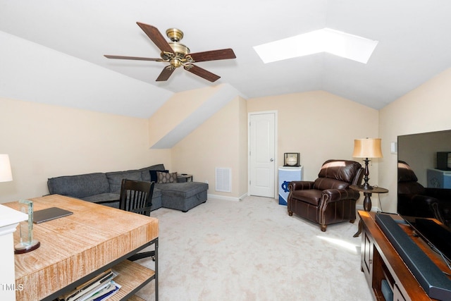 living room with light carpet, visible vents, vaulted ceiling with skylight, and a ceiling fan