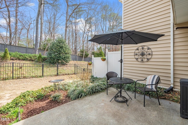 view of patio / terrace featuring fence