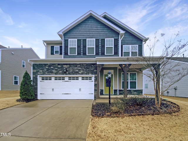 view of front facade featuring stone siding, covered porch, concrete driveway, and a garage