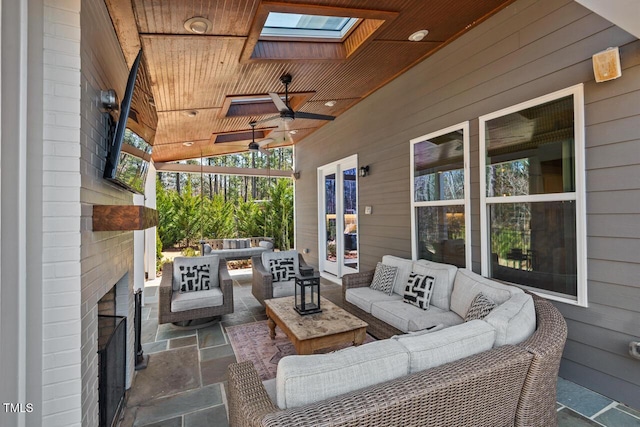 view of patio / terrace with outdoor lounge area and a ceiling fan