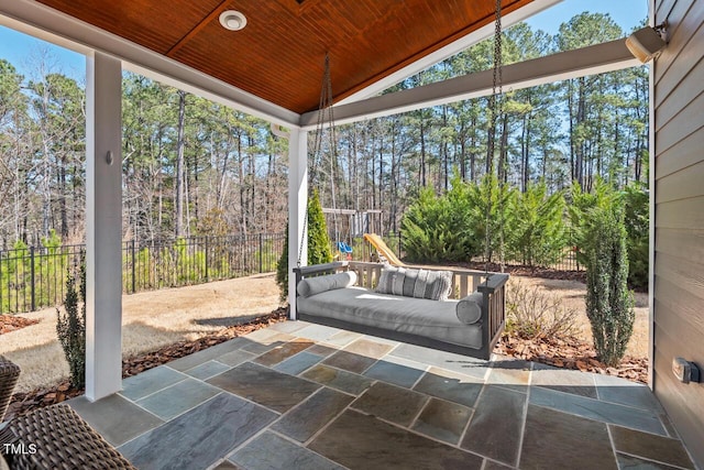 view of patio featuring fence