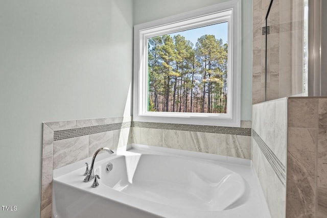 bathroom with a garden tub