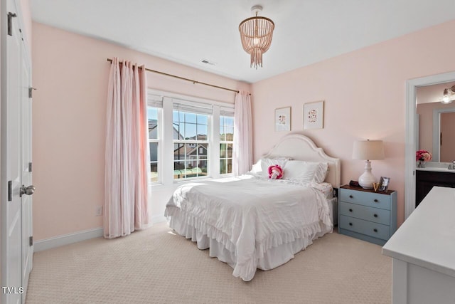 carpeted bedroom with baseboards and visible vents