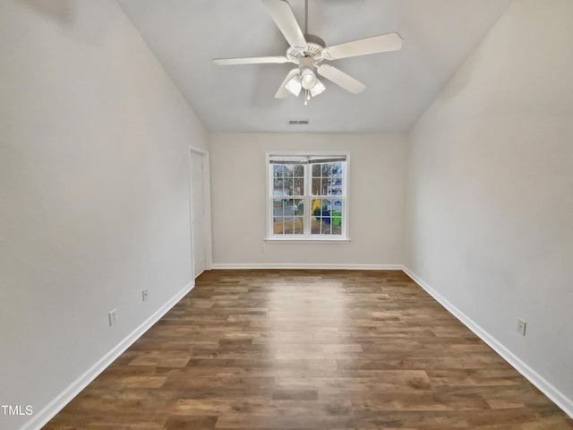 2356 Bay Harbor Dr, Raleigh, NC 27604 - empty room featuring visible vents, wood finished floors, baseboards, ceiling fan, and vaulted ceiling
