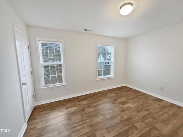 2356 Bay Harbor Dr, Raleigh, NC 27604 - empty room with wood finished floors, baseboards, and visible vents