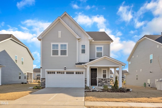 craftsman inspired home with a porch, driveway, board and batten siding, and stone siding