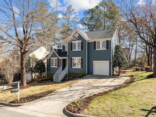 traditional-style home featuring concrete driveway, an attached garage, and a front yard