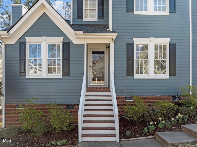 entrance to property with crawl space and roof with shingles