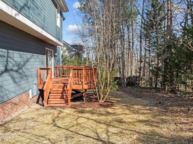 view of yard with fence and a wooden deck