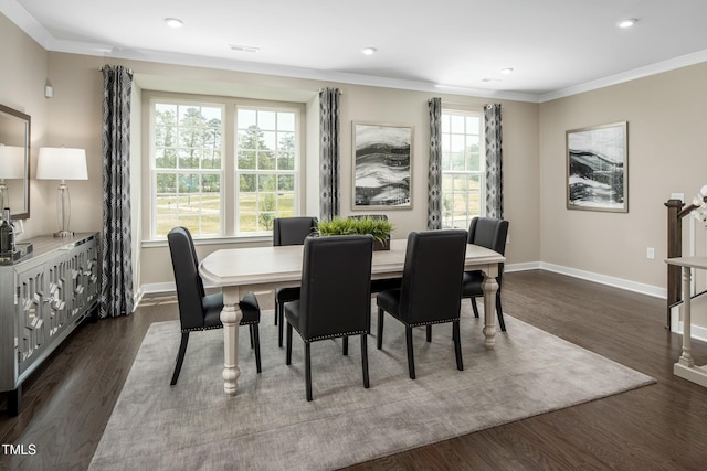 dining space featuring recessed lighting, crown molding, dark wood-type flooring, and baseboards