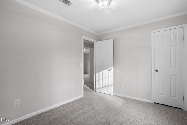 unfurnished bedroom featuring visible vents, baseboards, carpet, and ornamental molding