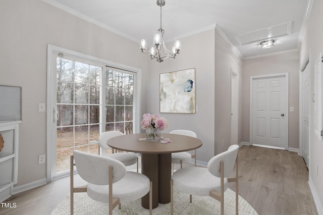 dining room with plenty of natural light, light wood-style flooring, and ornamental molding