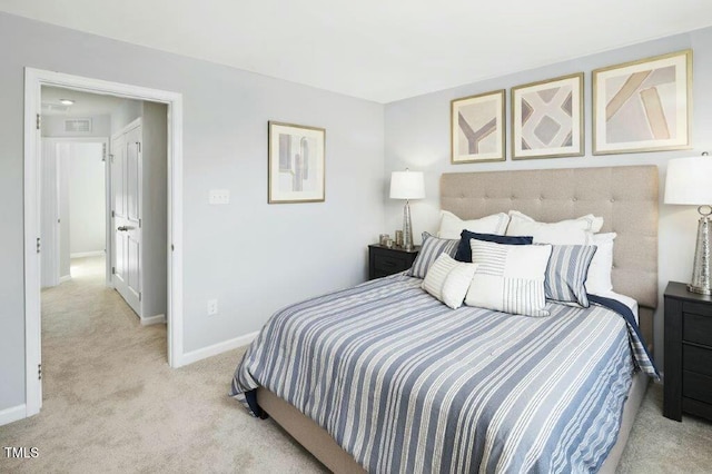 bedroom featuring visible vents, baseboards, and light colored carpet