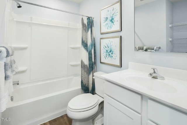 full bathroom with shower / bathtub combination with curtain, toilet, wood finished floors, and vanity